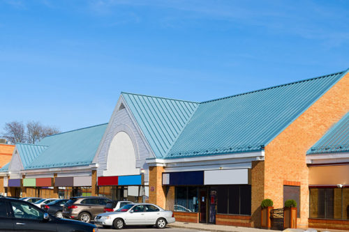 commercial building with blue roof