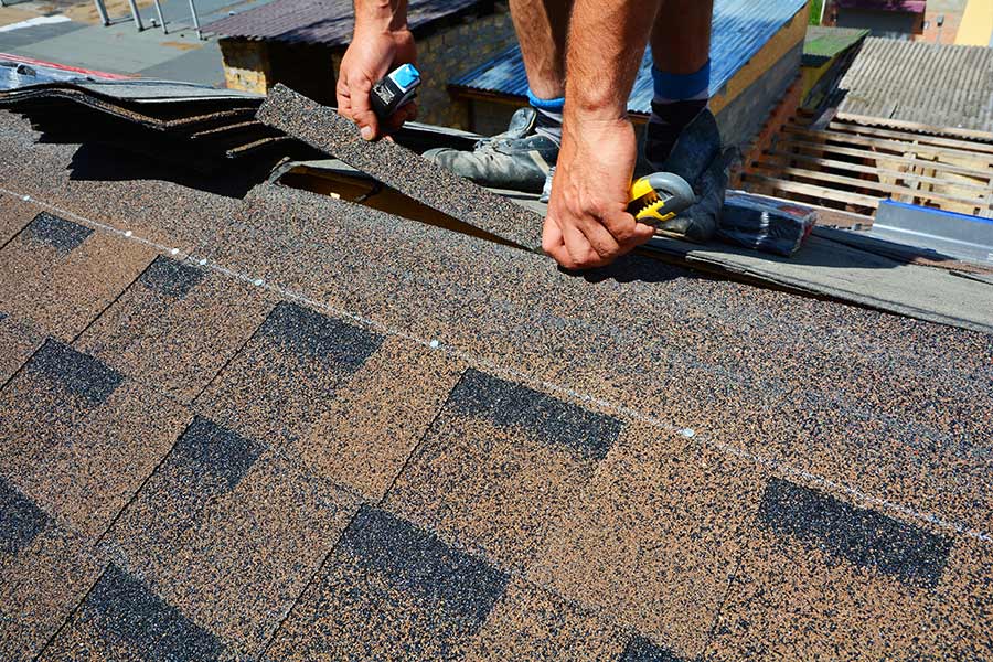 roofer repairing roof